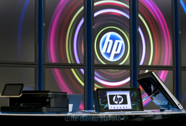 Hewlett-Packard Co. printers and computers sit on display in the lobby at the company’s headquarters in Palo Alto, California. (Bloomberg)