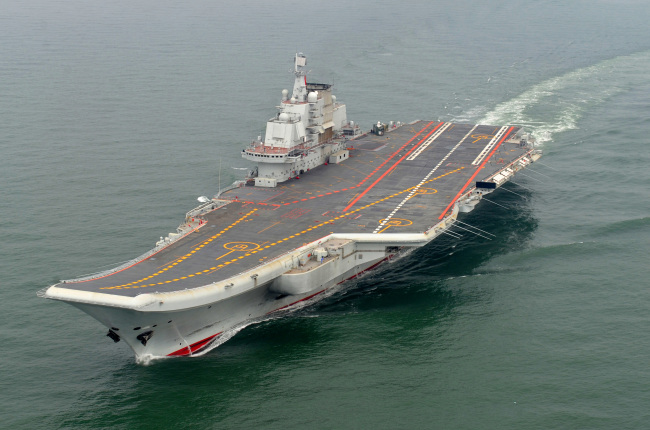 In this May 2012 photo provided by China’s Xinhua News Agency, Chinese aircraft carrier Liaoning cruises for a test on the sea. (AP-Yonhap News)