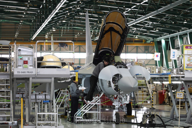 Employees work on a TA-50 trainer jet on the production line of the KAI plant in Sacheon, South Gyeongsang Province. (Bloomberg)