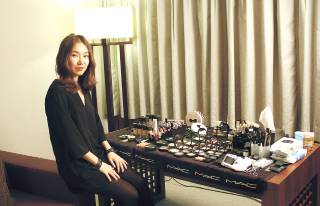 Make-up artist Kim Eun-ji poses for a photo in a suite at Haeundae Grand Hotel in Busan, Friday. (Claire Lee/The Korea Herald)