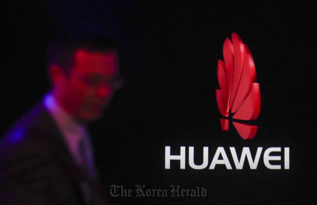 The logo of Huawei Technologies Co. is displayed at the Mobile World Congress exhibition in Barcelona. (Bloomberg)