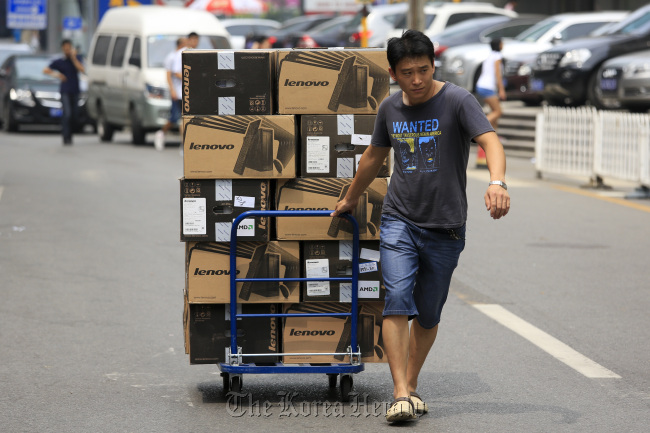 Lenovo Group Ltd. computers are transported in Beijing. (Bloomberg)