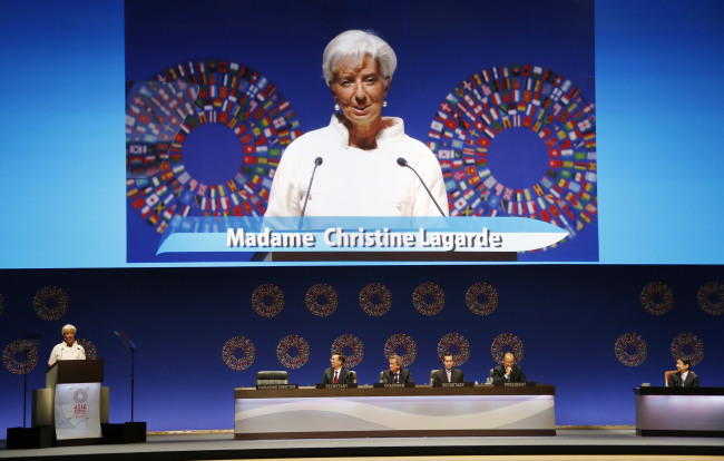 International Monetary Fund Managing Director Christine Lagarde (left) delivers a speech during the opening of the annual meetings plenary of IMF and World Bank Group in Tokyo on Friday. (AP-Yonhap News)