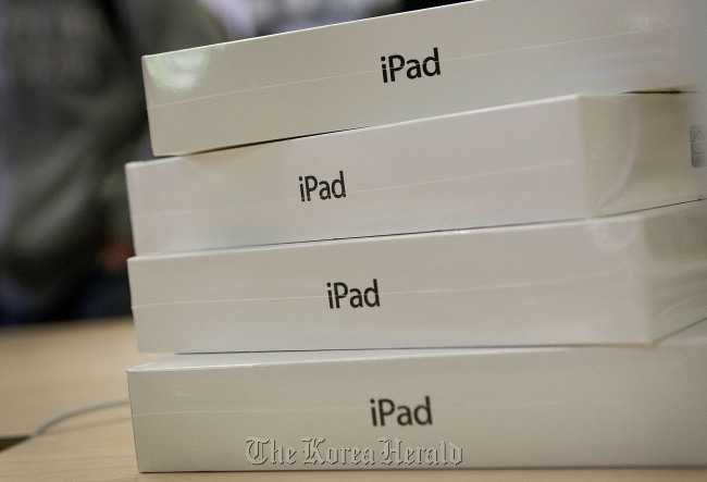 Apple Inc. iPads sit in boxes at the Apple store on 5th Avenue in New York. (Bloomberg)