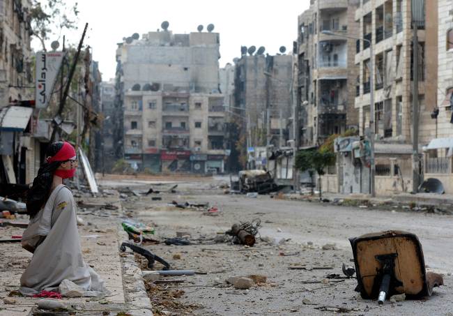 Debris is strewn along a street in the northern city of Aleppo, Syria, Tuesday. (AFP-Yonhap News)