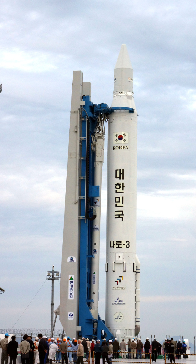 The Korea Space Launch Vehicle-1 is erected on the launch pad at the Naro Space Center on Wednesday. (Yonhap News)