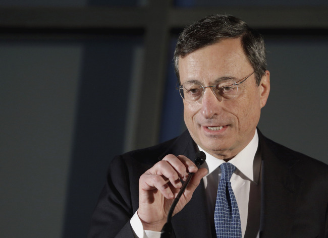 ECB president Mario Draghi addresses the media on Wednesday.(AP-Yonhap News)