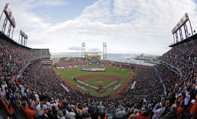 In this photo shot with a fisheye lens, Phillip Phillips sings the national anthem before the start of Game 1 of baseball`s World Series between the San Francisco Giants and Detroit Tigers Wednesday, Oct. 24, 2012, in San Francisco. (AP)