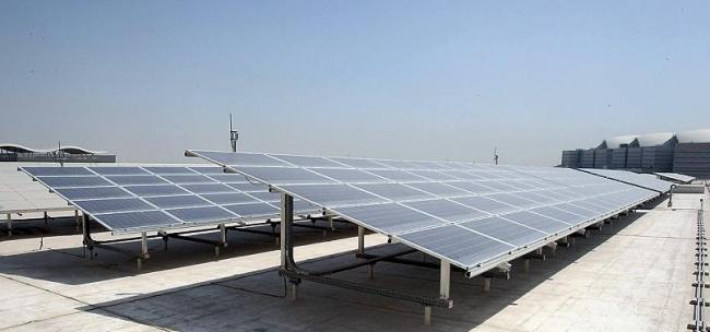 Solar panels are seen on the roof of the Qatar National Convention Center in Doha, Qatar. From the sustainably logged wood used in its construction to the 3,500 square meters of solar panels on the roof, the building designed by Japanese architect Arata Isozaki is considered one of the most environmentally sound convention centers in the world. (AP-Yonhap News)