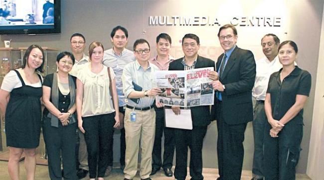 Than Htut Aung (fourth from right), CEO of Eleven Media Group, signs the agreement with ANN’s founding member Felix Soh (sixth from right) and Paul Linnarz (third from left), advisor to the ANN Executive Board and Director, at the Singapore Press Holdings’ Multimedia Centre on Oct. 23. (Asia News Network)