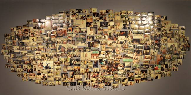 A collection of photographs of Templestay participants and others are on display at the “Self-Made Inspiration and Laughter Exhibition” at Sejong Museum of Arts in Seoul on Wednesday. (Lee Sang-sub/The Korea Herald)