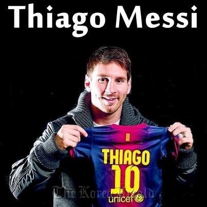 FC Barcelona‘s Lionel Messi from Argentina holds a jersey for his baby son Thiago Messi. (Messi's Facebook page)