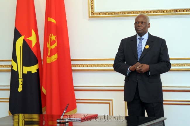 Angolan President Jose Eduardo dos Santos poses for a photo at his presidential office just after being re-elected in August.