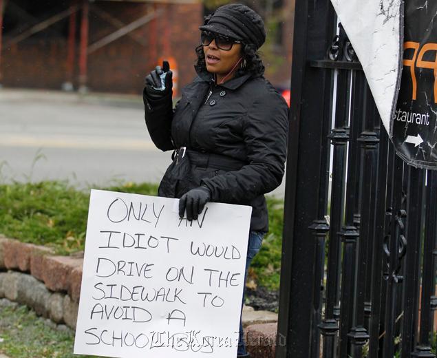 Shena Hardin, 32, was ordered by a court to stand on a street with a sign. (AP-Yonhap News)