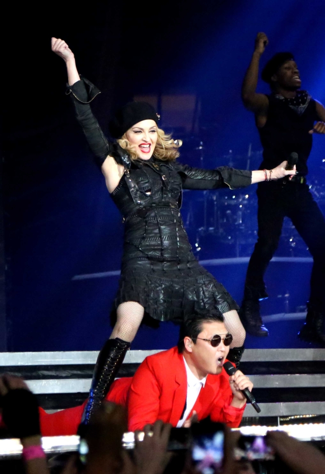 Madonna is shown onstage with South Korean rapper Psy during Madonna’s MDNA concert at Madison Square Garden in New York. (AP-Yonhap News)