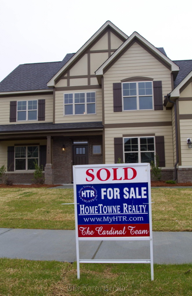 A sold sticker is displayed on a for sale sign outside of a home in Garner, North Carolina. (Bloomberg)