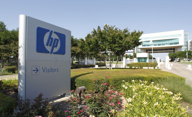 The Hewlett-Packard Co. logo is displayed outside the company’s HP Enterprise Services unit in Plano, Texas. (Bloomberg)