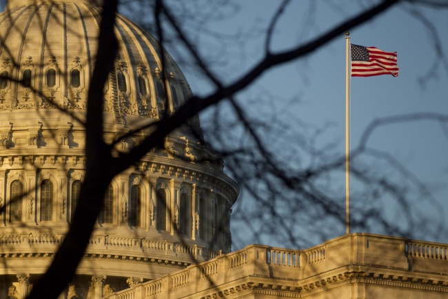 A U.S. flag flies outside the Capitol building in Washington, D.C. (Bloomberg)