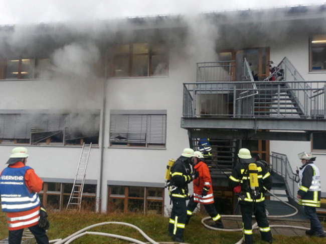 In this image taken from video, firefighters try to extinguish flames in a workshop for disabled people in Titisee-Neustadt, southwestern Germany, Monday. (AP-Yonhap News)