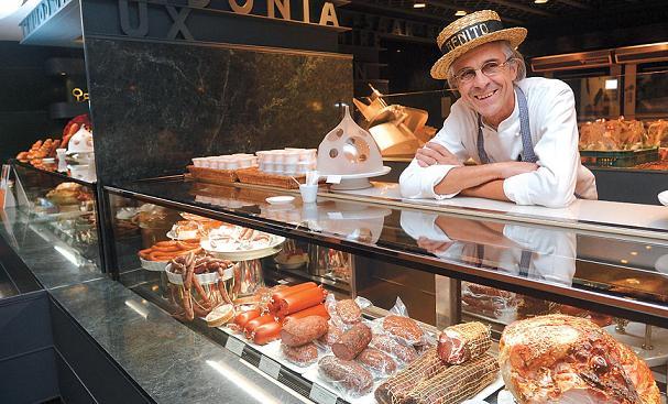 Belgian charcutier Benito Plasschaert poses for a photo behind the charcuterie product display at The Deli of Grand Hyatt Seoul. (Lee Sang-sub/The Korea Herald)