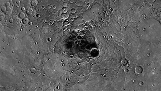 A 68-mile-diameter crater, large indentation at center, in the north polar region of Mercury (AP)