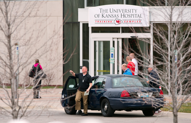 A police official exits his car in front of the Kansas City Chiefs practice facility in Kansas City, Missouri, on Saturday, following the suicide of Kansas City Chiefs linebacker Jovan Belcher at the facility. (MCT)