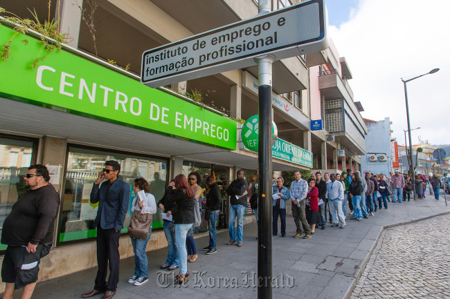 Jobseekers queue outside an employment center in Sintra, Portugal. (Bloomberg)