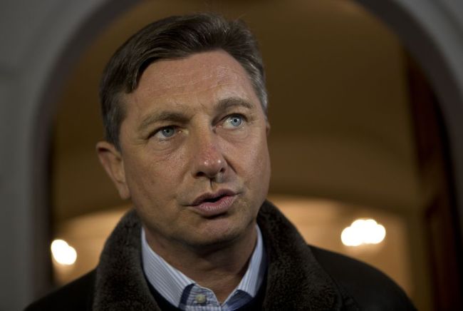 Slovenia`s former prime minister Borut Pahor talks to the media outside a polling station in Sempeter, Slovenia, Sunday, Dec. 2, 2012. (AP)