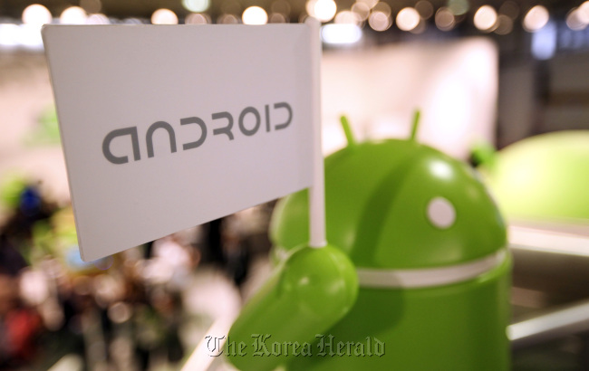 A model of the Android operating system logo stands on display at the company’s booth at the Mobile World Congress in Barcelona. (Bloomberg)