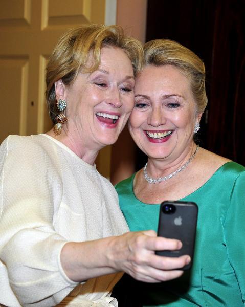 Meryl Streep takes a photo of herself with United States Secretary of State Hillary Rodham Clinton following a dinner honoring the seven 2012 recipients of the Kennedy Center honors at the U.S. Department of State in Washington, D.C. on Saturday, December 1, 2012.