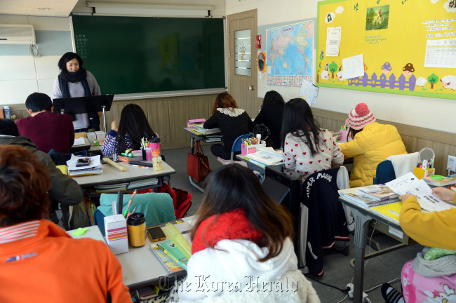 North Korean defectors attend a class at Yeomyung School in central Seoul. Chung Hee-cho/The Korea Herald