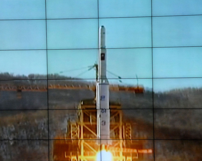 Photo released by the official KCNA news agency of the Democratic People's Republic of Korea (DPRK) on Dec. 12, 2012 shows the Unha-3 carrier rocket launching with the satellite Kwangmyongsong-3, on a monitor screen at the satellite control center. According to the KCNA, the second version of Kwangmyongsong-3 was launched by an Unha-3 carrier rocket at 9:49 a.m. local time (0049 GMT) Wednesday from the Sohae Space Center in Cholsan County, North Phyongan Province, and entered the preset orbit. (Xinhua-Yonhap News)