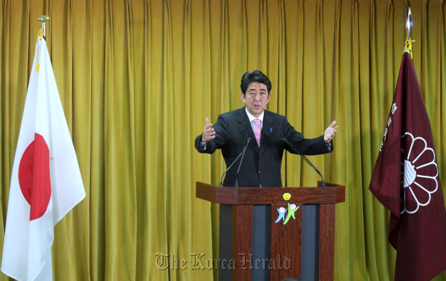 Shinzo Abe, Japan`s incoming prime minister and president of the Liberal Democratic Party, speaks at a news conference at the party`s headquarters in Tokyo on Monday. (Bloomberg-Yonhap News)