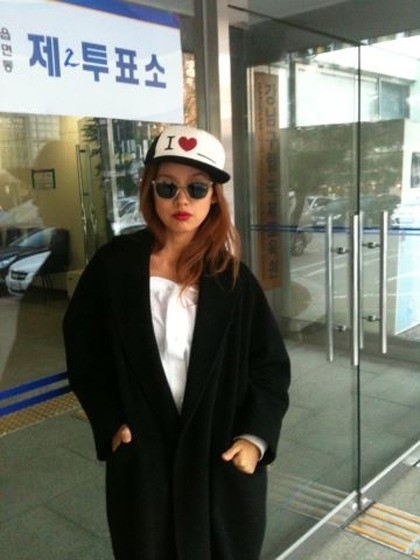 S. Korean singer Lee Hyo-ri poses in front of a presidential election polling place in Seoul. (Twitter)