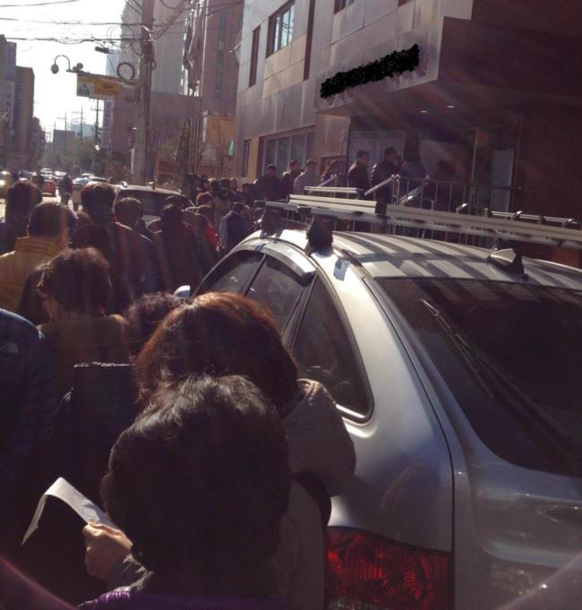 Voters line up outside a polling station in Seoul on Wednesday.