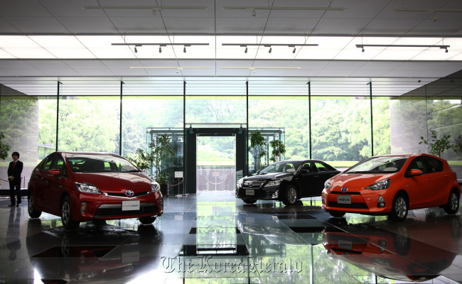 Toyota Motor Corp. Prius plug-in and Aqua hybrid vehicles are displayed at the company’s Tokyo head offices. (Bloomberg)