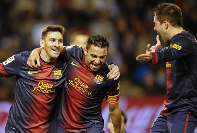 FC Barcelona’s Lionel Messi from Argentina (left), Xavier Hernandez (center) and Gerard Pique celebrate after scoring during a Spanish La Liga soccer match against Real Valladolid at the Jose Zorrilla stadium in Valladolid, Spain, Saturday. (AP-Yonhap News)