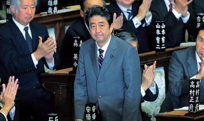 Japan’s Liberal Democratic Party leader Shinzo Abe acknowledges applause from lawmakers after being named Japan’s new prime minister at the lower house of Parliament in Tokyo on Wednesday. (AP-Yonhap News)