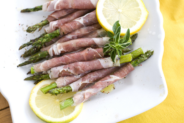 Prosciutto-wrapped grilled spring asparagus. (AP)