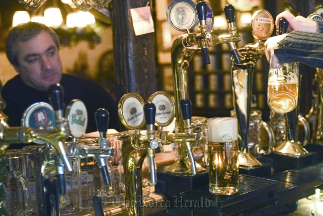 A customer enjoys a drink at a bar in Moscow. (Bloomberg)