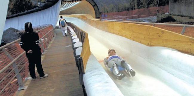 A Luger ends his test run at the Sliding Center Sanki located in Rzhanaya Polyana, Russia. Sochi, Russia will host the 2014 Winter Olympics. (Los Angeles Times/MCT)