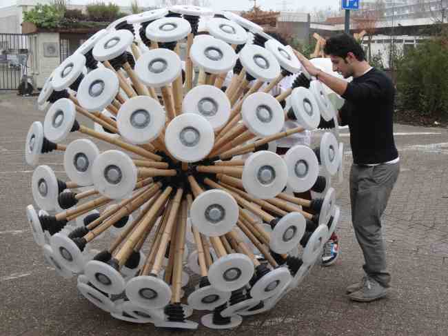 Mahmud Hassani pushes the “mine kafon,” a wind-driven gadget to clear anti-personnel mines, at an Eindhoven workshop. (AFP-Yonhap News)