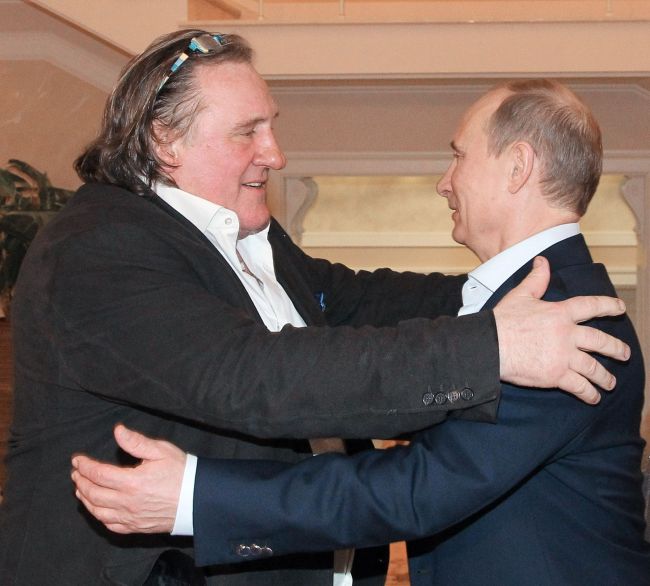 Russian President Vladimir Putin (right) greets French actor Gerard Depardieu during their meeting in Putin’s residence in Sochi on Saturday. (AFP-Yonhap News)