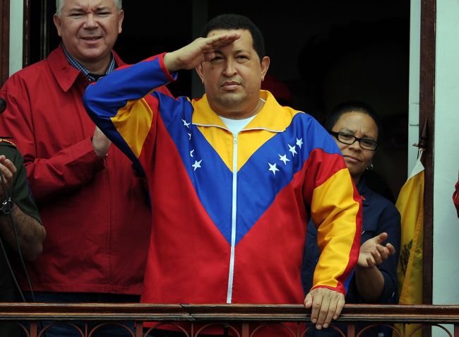 This file picture shows Venezuelan President Hugo Chavez saluting supporters from a balcony of the presidential palace in Caracas on March 17, 2012. (AFP-Yonhap News)