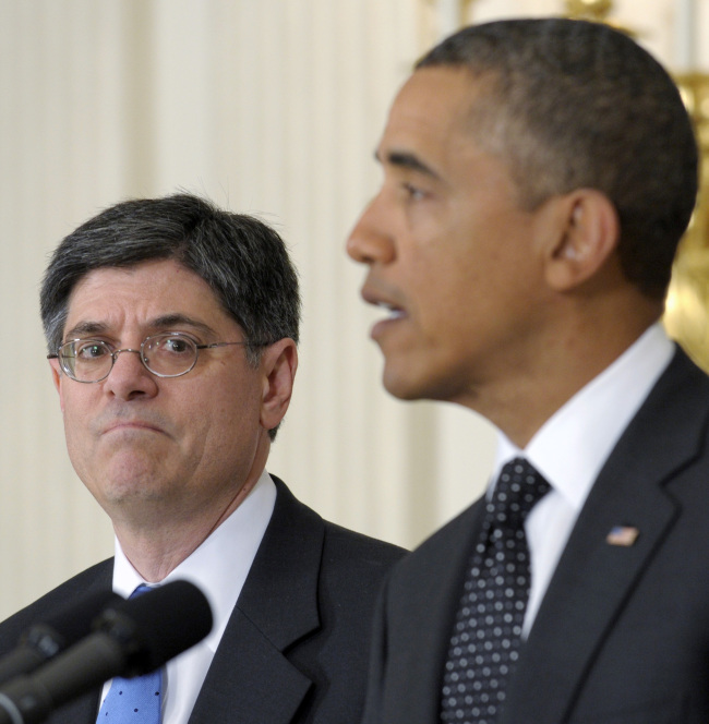 This file photo shows then-Budget Director Jack Lew (left) listening as President Barack Obama speaks in the State Dining Room of the White House in Washington. (AP-Yonhap News)