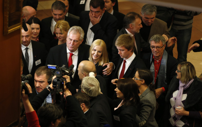 Presidential candidate Milos Zeman (center) smiles while addressing the media after announcing the preliminary results of the presidential elections in Prague on Saturday. (AP-Yonhap News)