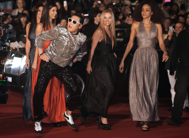 Psy arrives at the Cannes festival palace to take part in the NRJ Music Awards ceremony on Saturday. (AP-Yonhap News)