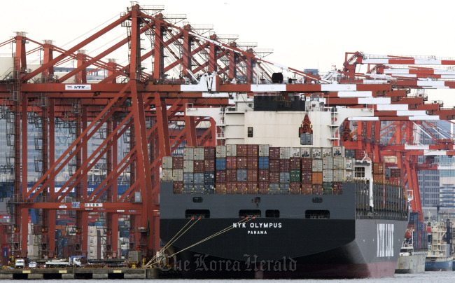 A Nippon Yusen K.K. container ship is moored at a shipping terminal in Tokyo. (Bloomberg)