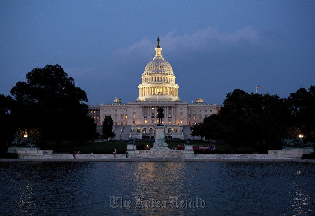 The U.S. Capitol building stands at night in Washington, D.C. (Bloomberg)