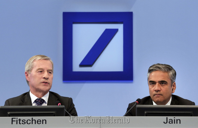 Joint CEOs Juergen Fitschen (left) and Anshu at Deutsche Bank’s annual news conference in Frankfurt. (Bloomberg)